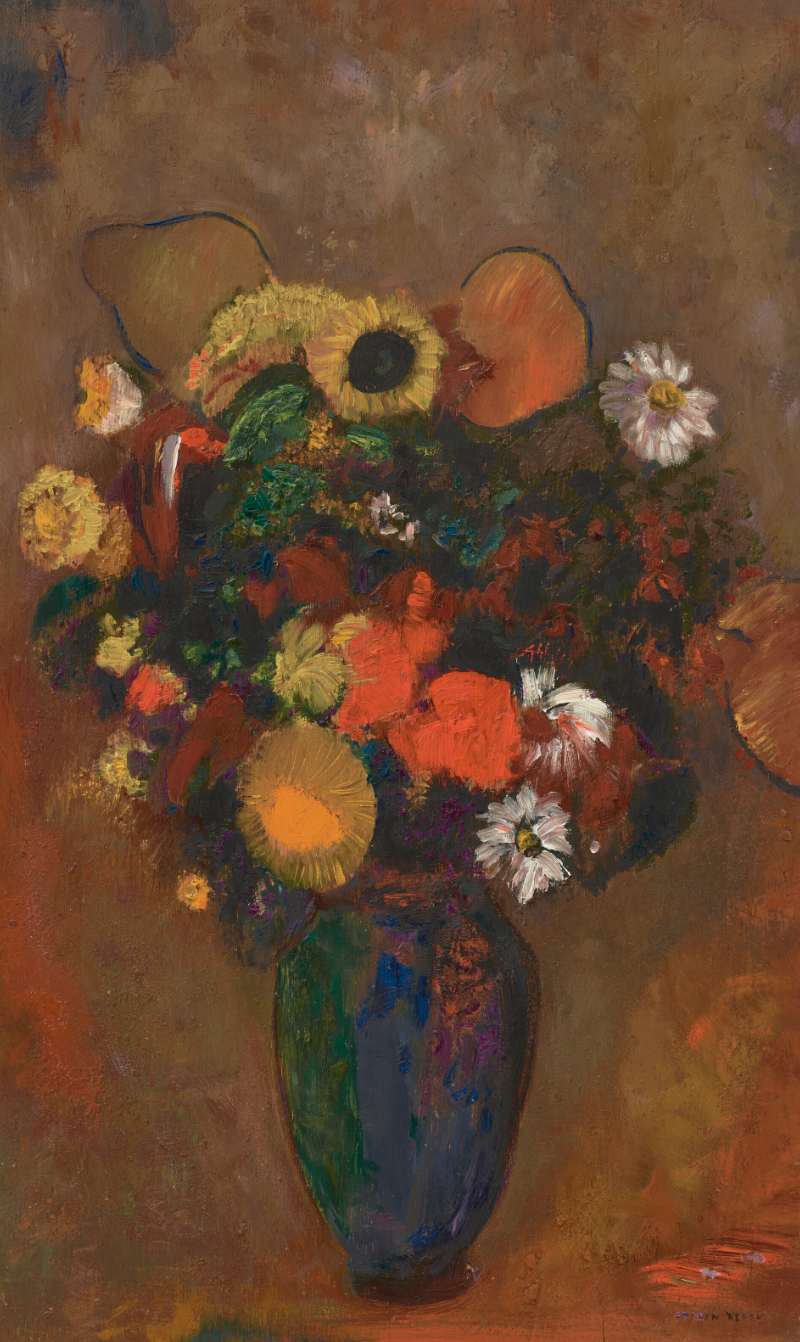 Fleurs dans un vase vert