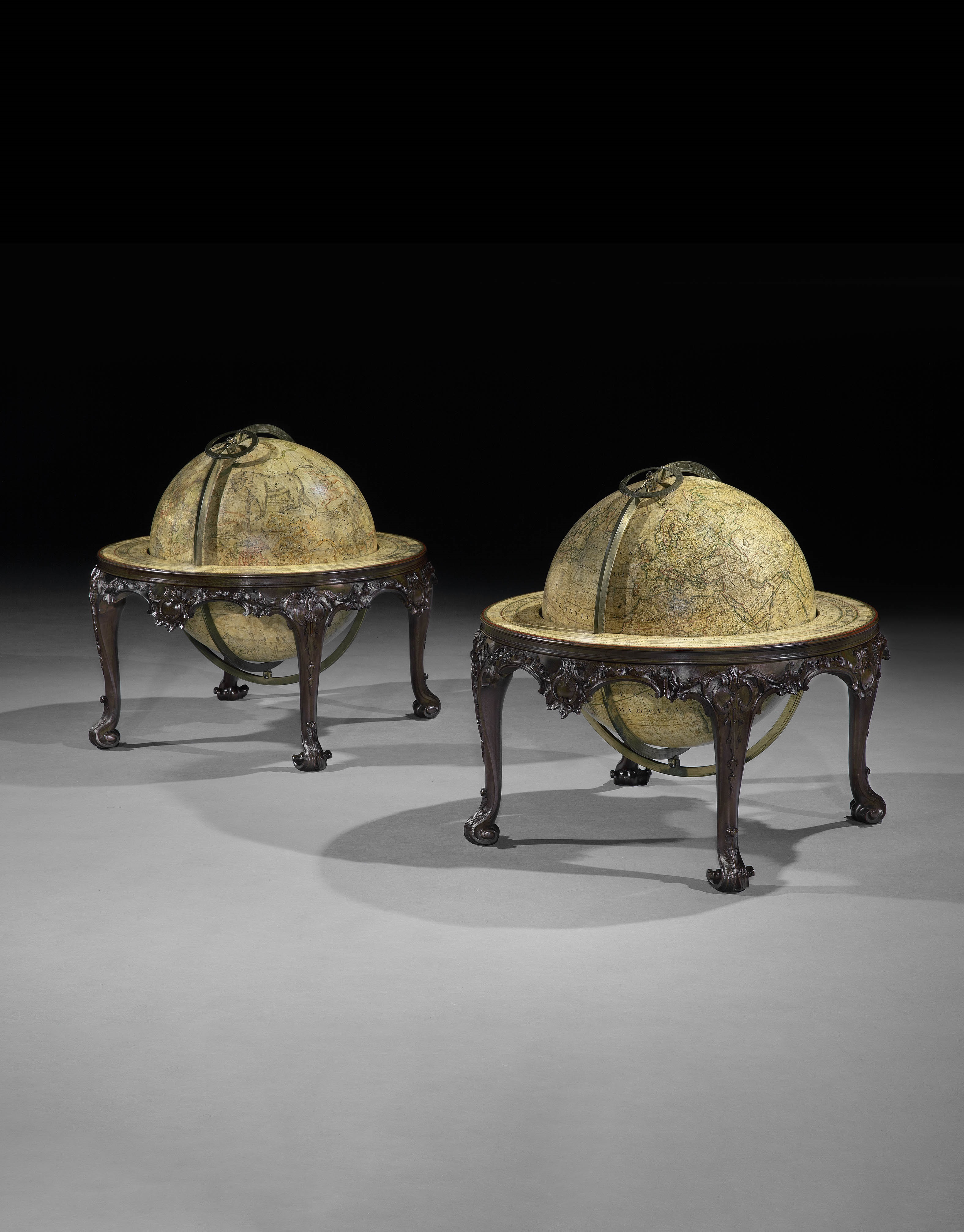 A PAIR OF GEORGE II 16 INCH TABLE GLOBES BY JOHN SENEX ON MAHOGANY STANDS