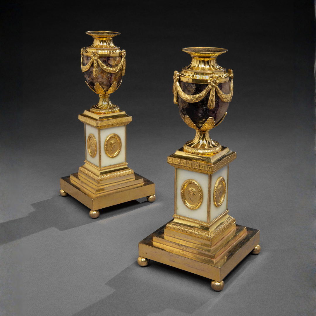 A PAIR OF GEORGE III CLEOPATRA CANDLE VASES BY MATTHEW BOULTON